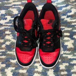 Red and black Nike all day play